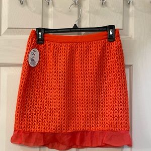 New orange skirt ,size small.